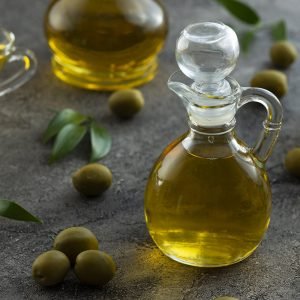high-view-bottles-filled-with-olive-oil-marble-background